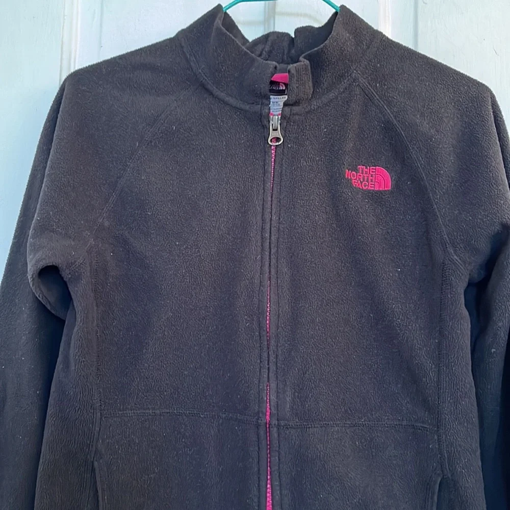 The North Face girls black fleece jacket in size medium 10-12